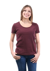 Fototapeta premium Young woman in stylish t-shirt on white background. Mockup for design