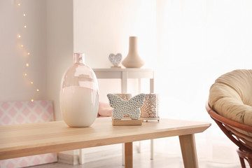 Wooden table with different decors in living room