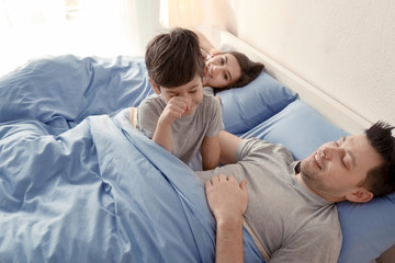 Happy family waking up in morning at home