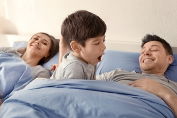 Happy family waking up in morning at home