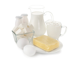 Different dairy products and eggs on white background