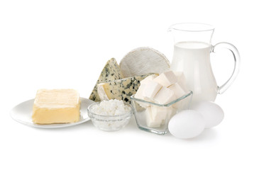 Different dairy products and eggs on white background