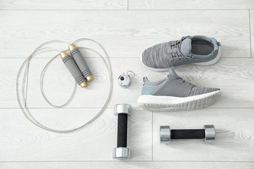 Composition with sport shoes on floor