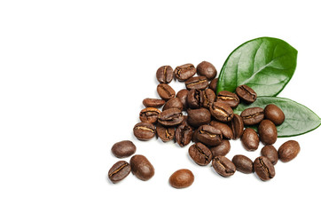 Shiny fresh roasted coffee beans with leaves isolated on white background