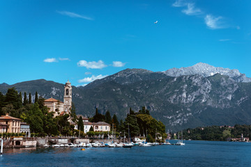 Fototapeta premium Amazing view of bright blue Como lake, Lombardy Italy, panorama of the lake and the city. Mountains on the background and good sunny summer weather