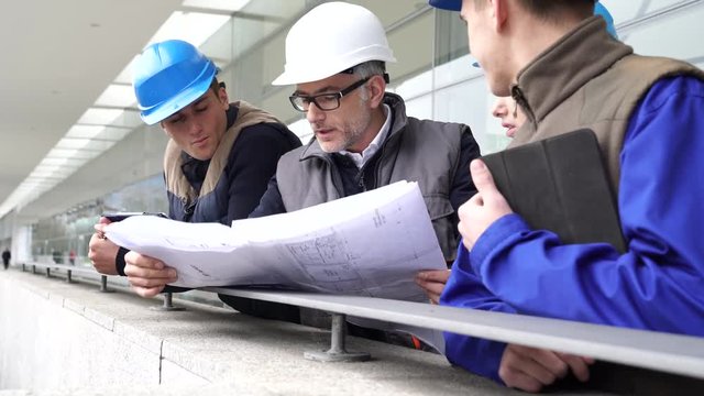 Instructor with young people in engineering training