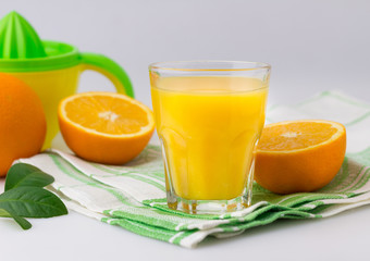 Fresh citrus fruit Juice on the white table Citrus press