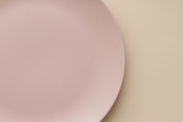 Empty ceramic plate pattern design on light background.