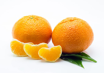 mandarin with green leaf isolated on white background