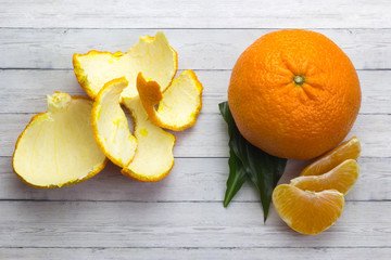 tangerines with leaves on wooden grey table