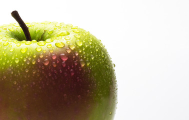Green and red fresh apple with water drops