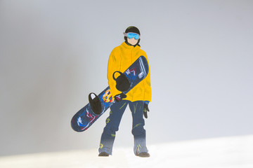 Man holding snowboard in hands. Closeup view. Snowboarder or snowboarding concept. For design.