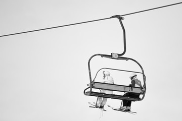skiers on a funicular railway cable car