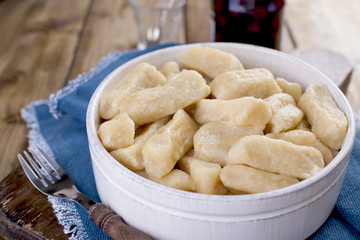 Homemade dumplings with cheese and vanilla. In a rustic style, in a ceramic cup. Healthy vegetarian food. Home cooking. Russian kitchen