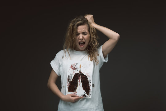Waist up portrait of girl standing with image of sick lungs and screaming. Isolated on background