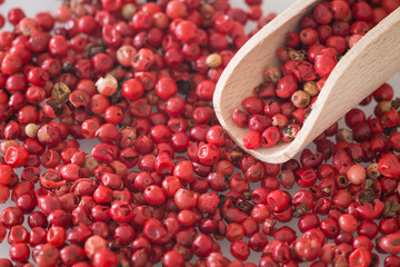 Brazilian pepper on the dark stone table