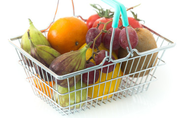 Shopping basked with fruits and vegetables on a white backgrounds / concept healthy, nutrition supporting the diet
