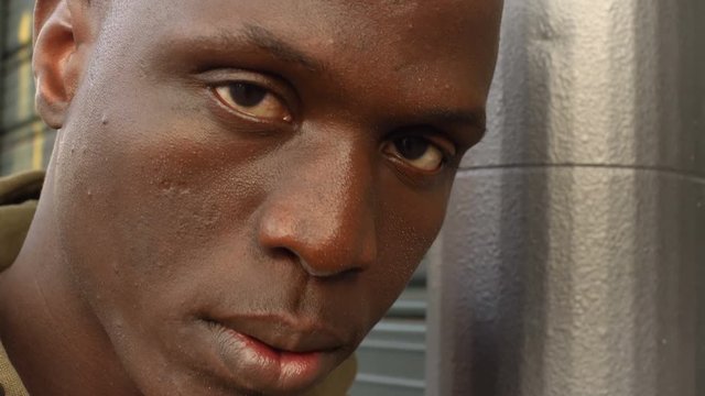 Sad African youg man, close up portrait