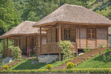 wooden vacation bungalows in jungle