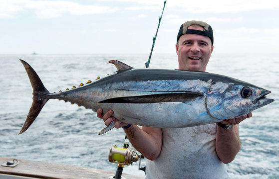 Angler with white tuna fish