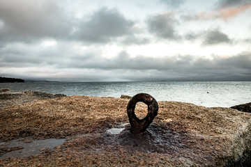 Fototapeta premium Rusty Eyebolt in the Rocks of Rockland Breakwater