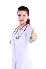 Portrait of young woman doctor with white coat standing in hospital . Portrait of young woman doctor