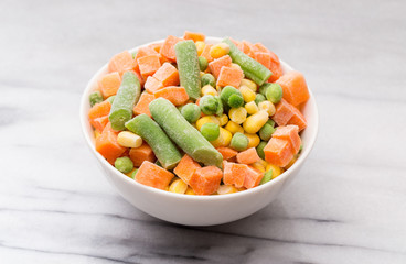 Mixed Vegetables Isolated on a White Marble Background