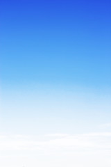 Obraz premium Blue sky background and white clouds soft focus, and copy space