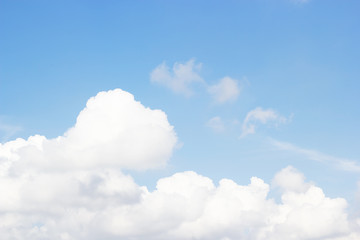 Naklejka na ściany i meble Soft white clouds against blue sky background and empty space