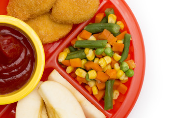 Children's Plate with a Well Balanced Meal of Chicken Nuggets, Vegetables and Sliced Apple