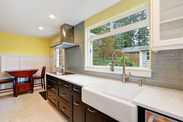 Newly remodeled kitchen ftted with chocolate brown cabinets