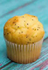 Lemon Poppyseed Muffins on a Blue Wooden Table