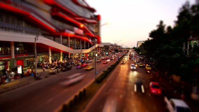 4K : Abstract blurred time lapse congestion traffic at Chatuchak market in Bangkok,Thailand - Miniature effect
