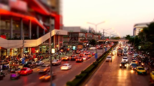 Abstract blurred time lapse congestion traffic at Chatuchak market in Bangkok,Thailand - Miniature effect