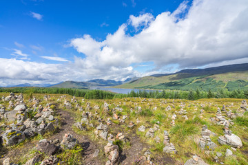 Fototapeta na wymiar Rock balancing in a stunning Highlands landscape near Loch Cluanie, Scotland, Britain