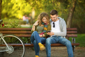 Young couple in love on bench