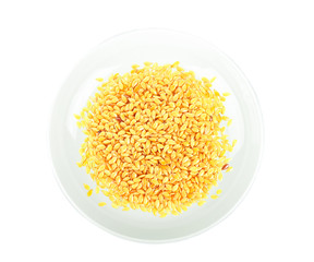 Flax seeds isolated in white plate on white background