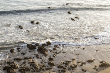 Fototapeta na wymiar The Rocks in the Beach