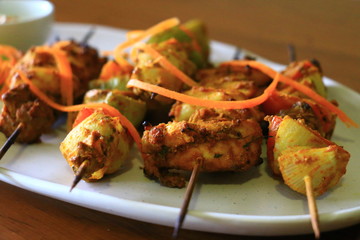 Delicious Chicken Tikka and Vegetable tikka served in white plate. Chicken dish.