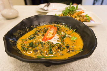 Close up traditional thai food red curry with Acasia