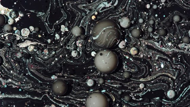 Top view Bright Collors Bubbles Slow Motion Oil Ink is fantastic structure of colorful chaotic motion bubbles stock video is a beautiful, unique, organic.