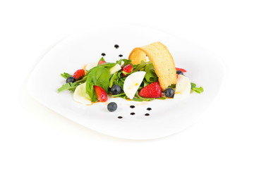 fresh vegetable salad with strawberries on white isolated background