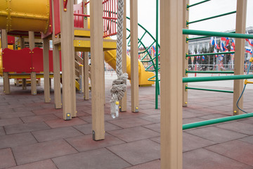 Fototapeta na wymiar Playground in the street on rubber tiles