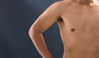 Obraz premium Young and healthy man shirtless show his muscles.