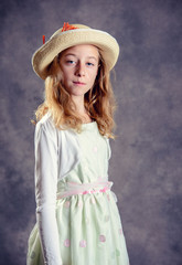 blond girl in white dress and straw hat