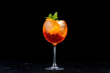 alcoholic beverage on a black background