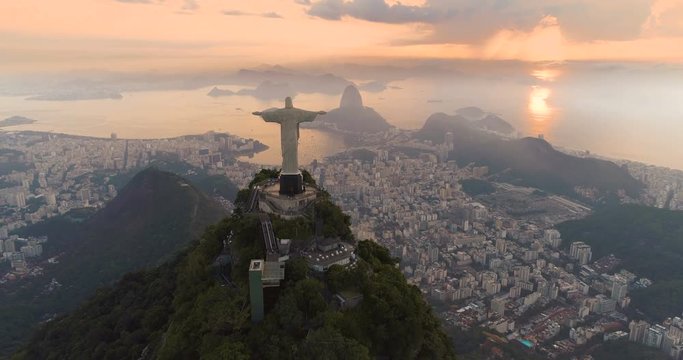 Aerial view of Christ the Redeemer Statue and Botafogo Bay. Morning sunrise light, Rio de Janeiro, Brazil