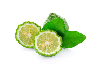 Lime and leaves on a white background.
