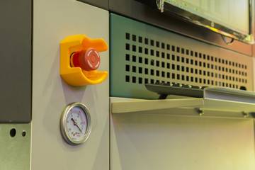 Emergency stop button and vacuum gage