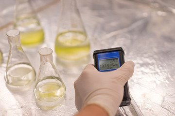 the scientist measures the level of radioactive radiation from the samples